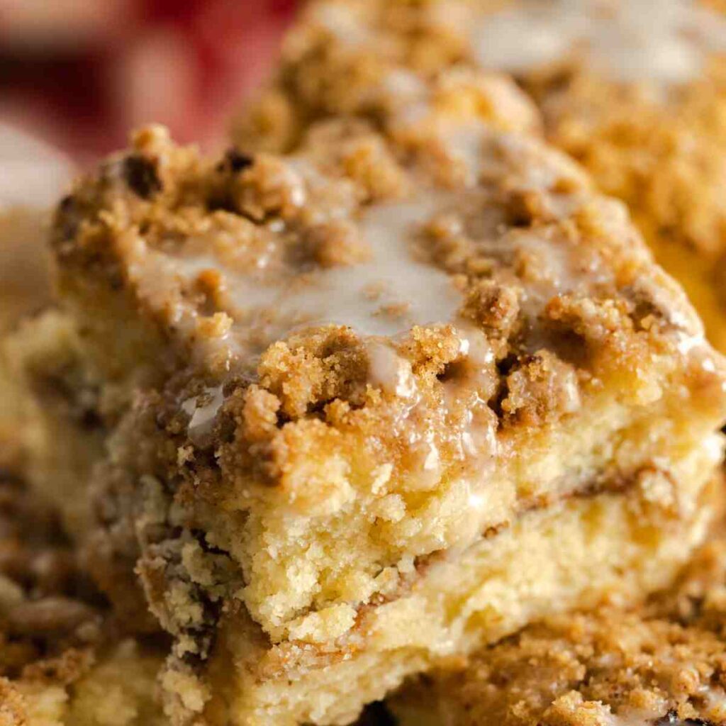 Slice of sour cream coffee cake on a plate.